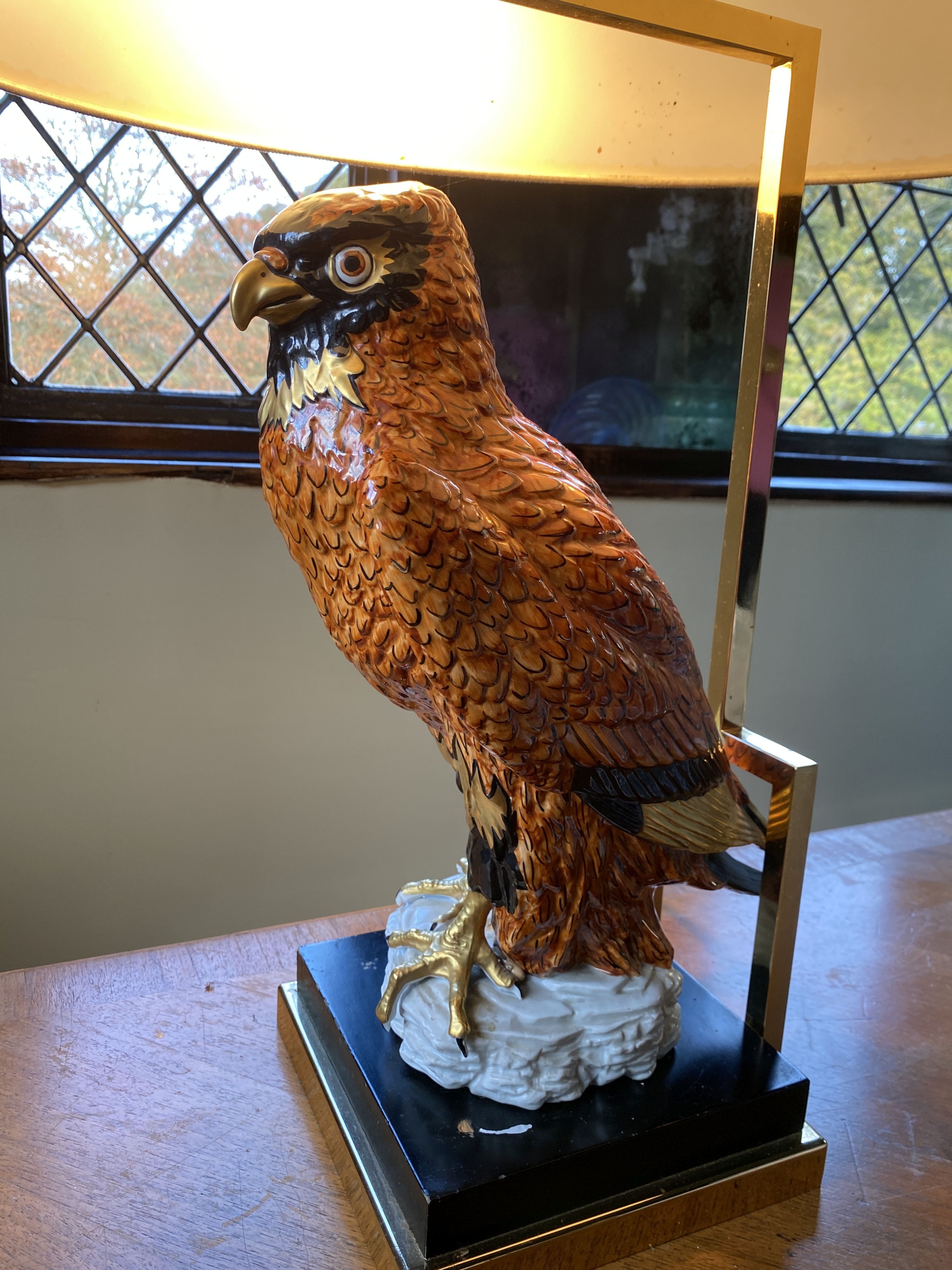 A Continental porcelain owl lamp base, with lacquered brass mounts, height of base 45cm